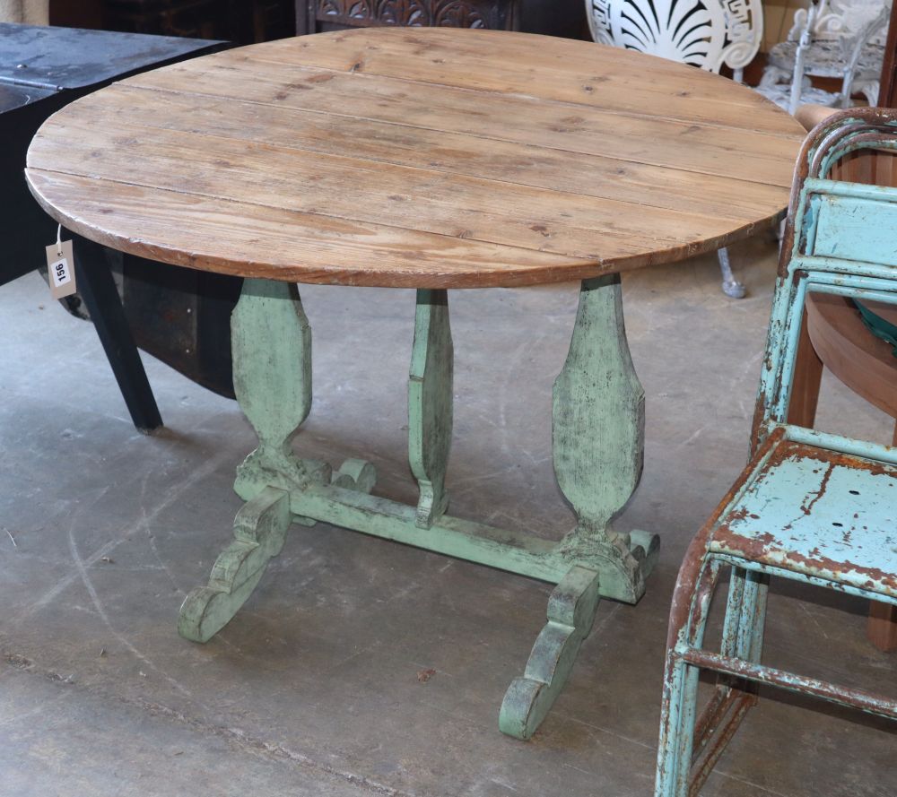 A 19th century Continental circular pine folding tilt top table, 104cm diameter, H.73cm